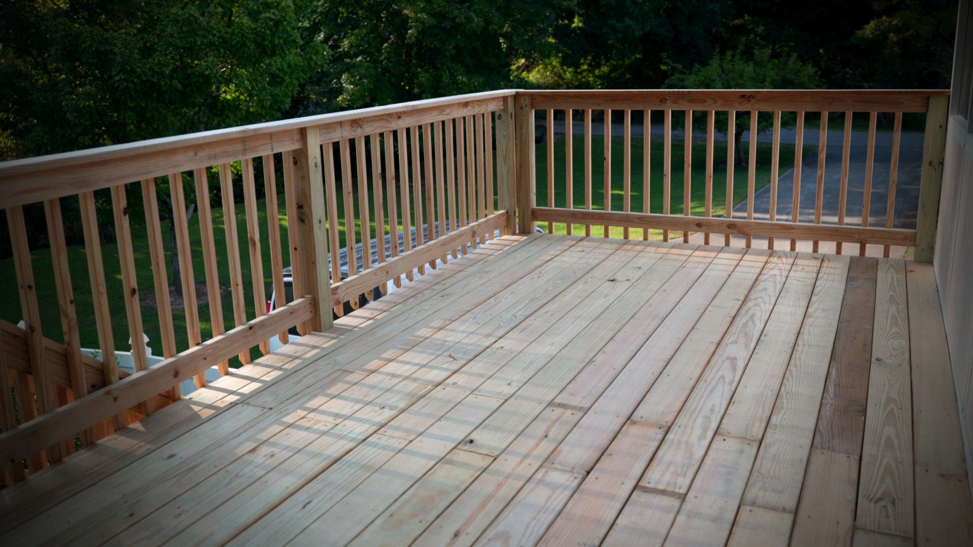 Finished pressure-treated wood deck at golden hour, Middle Tennessee