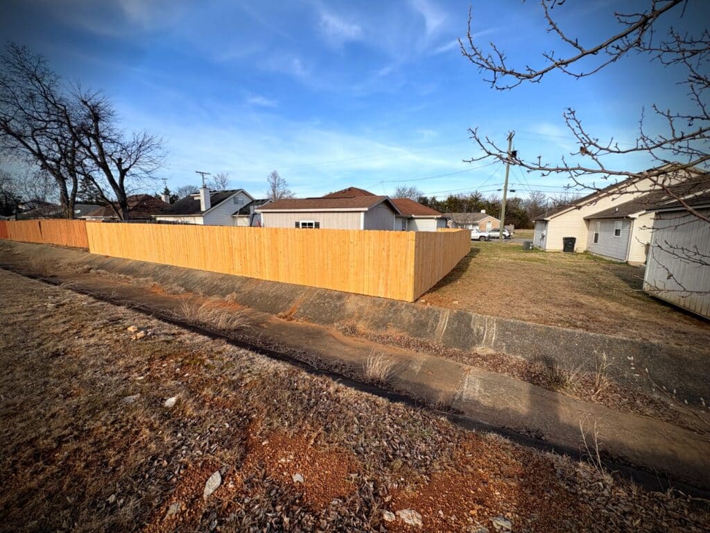 Newly completed cedar privacy fence from street view in Middle Tennessee neighborhood